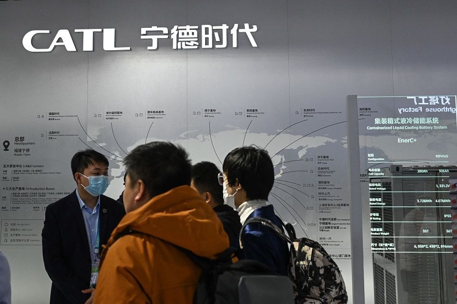 People visit the booth of Chinese battery maker CATL (Contemporary Amperex Technology Co. Ltd.) during the China International Supply Chain Expo (CISCE) in Beijing on 1 December 2023. (Jade Gao/AFP)