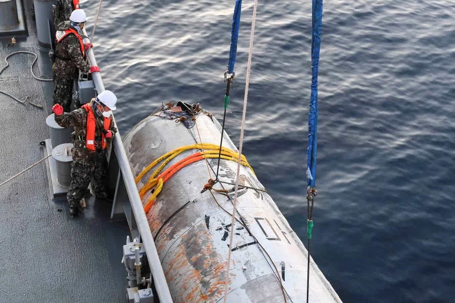 A handout picture shows a part of what is believed to be a space launch vehicle that North Korea said crashed into the sea off the west coast of the divided peninsula, and which the South Korean military had salvaged, at an unidentified location in South Korea, 15 June 2023. (The defence ministry/Handout via Reuters)