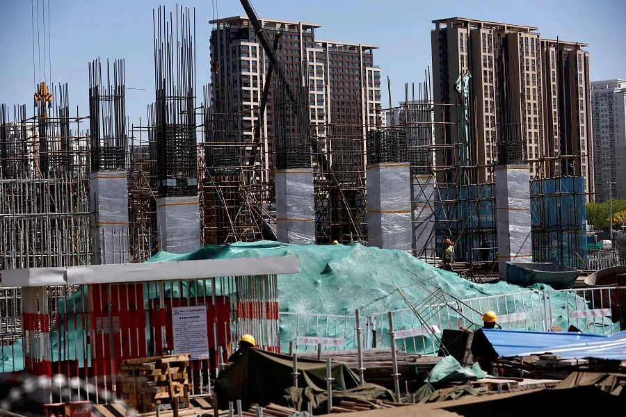 Workers work at a construction site of a subway station in Beijing, China, on 18 April 2023. (Tingshu Wang/File Photo/Reuters)