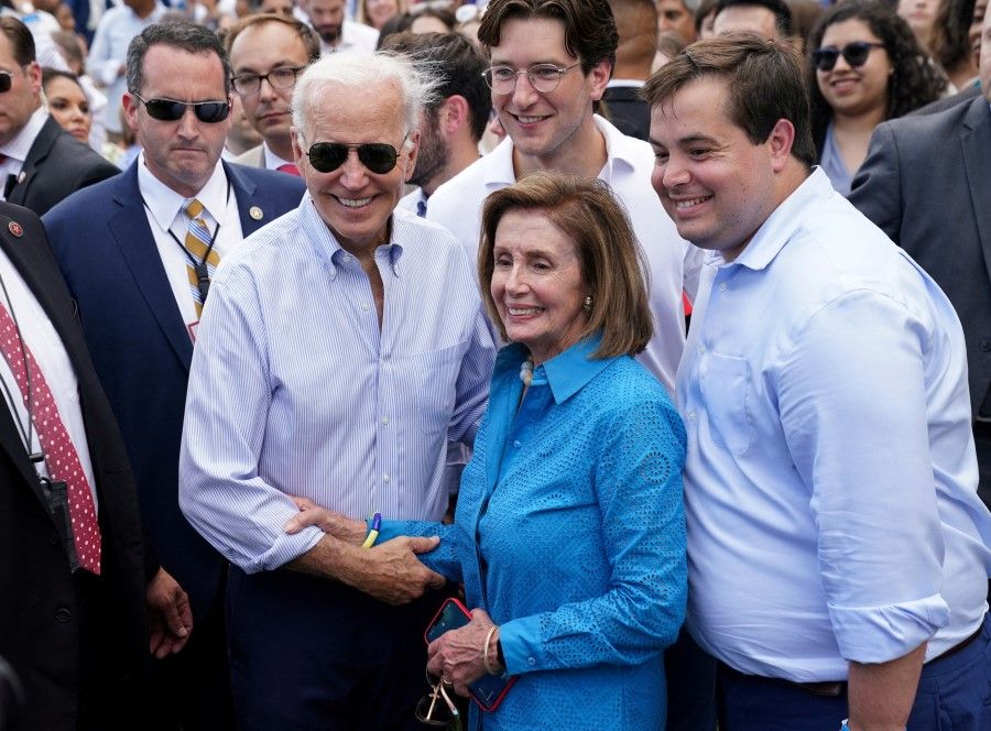 US President Joe Biden and Speaker of the House Nancy Pelosi pose for a photo at the Congressional Picnic on the South Lawn of the White House in Washington, US, 12 July 2022. (Kevin Lamarque/Reuters)