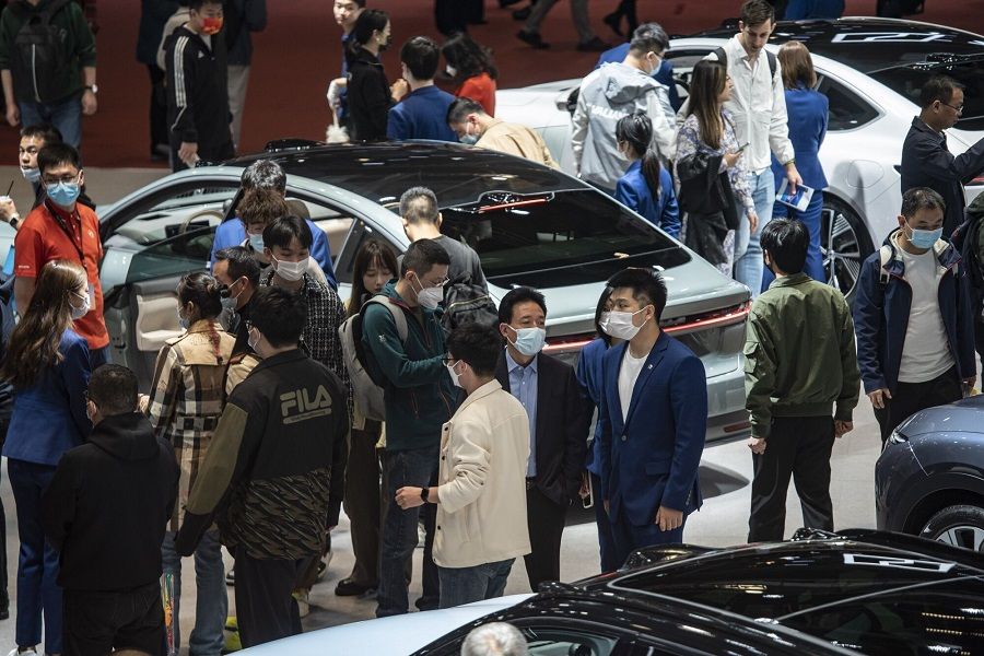 Visitors at the Nio Inc. booth at the Shanghai Auto Show in Shanghai, China, on 24 April 2023. (Qilai Shen/Bloomberg)