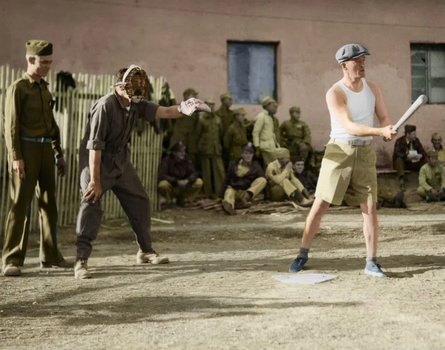 Lt. Gen. Claire L. Chennault in shorts and cap, playing baseball with the 14th Air Force, 29 June 1943. Chennault was born in 1893 in Commerce, Texas, making him 50 years old at the time this photograph was taken. However, he was still strong enough to play all nine innings, winning the admiration of his opponents and the reporters on scene.