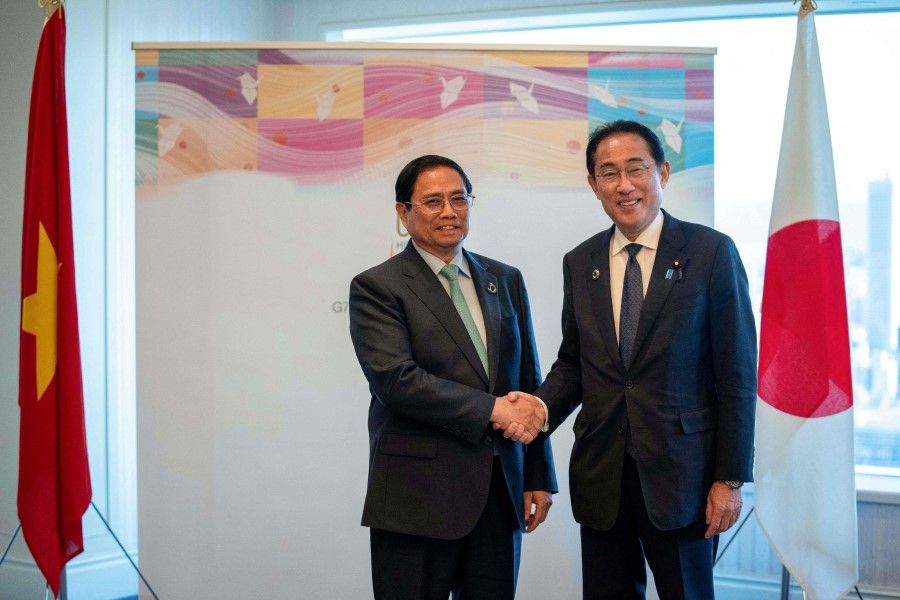 Japan's Prime Minister Fumio Kishida (right) shakes hands with Vietnam's Prime Minister Pham Minh Chinh before their bilateral meeting on the sidelines of the G7 Summit Leaders' Meeting in Hiroshima on 21 May 2023. (Zhang Xiaoyu/AFP)