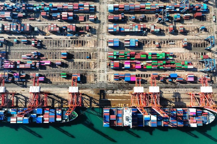 This photo shows an aerial view of shipping containers stacked at the Lianyungang Port in Lianyungang, Jiangsu province, China, on 26 March 2024. (AFP)