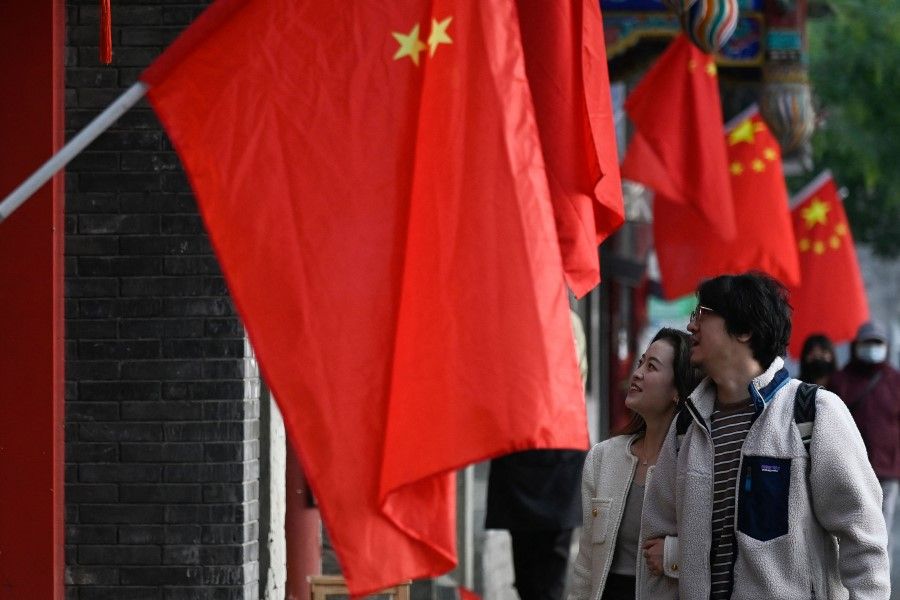 Chinese flags along a street in Beijing on 12 October 2022, ahead of the 20th Communist Party Congress meeting. (Wang Zhao/AFP)