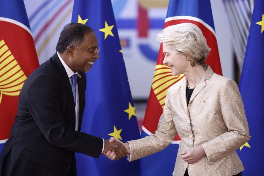 Malaysia's Minister of Foreign Affairs Zambry Abdul Kadir (left) shakes hands with President of the European Commission Ursula von der Leyen as they attend the EU-ASEAN (Association of Southeast Asian Nations) summit at the European Council headquarters in Brussels on 14 December 2022. (Kenzo Tribouillard/AFP)