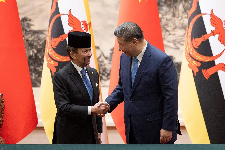 Chinese President Xi Jinping and Sultan of Brunei Haji Hassanal Bolkiah shake hands during a signing ceremony at the Great Hall of the People in Beijing on 6 February 2025.