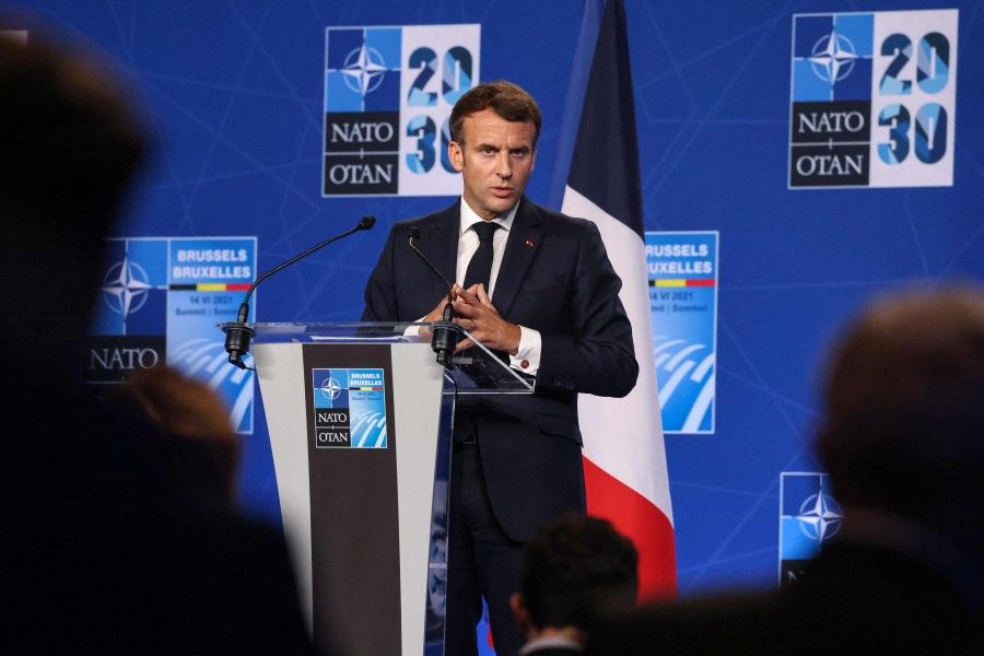 French President Emmanuel Macron gives a press conference during a NATO summit at the North Atlantic Treaty Organization (NATO) headquarters in Brussels on 14 June 2021. (Thomas Coex/AFP)