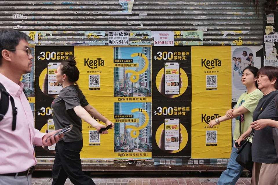 People walk past KeeTa advertisements in Mong Kok, Hong Kong, China. (HKCNA)