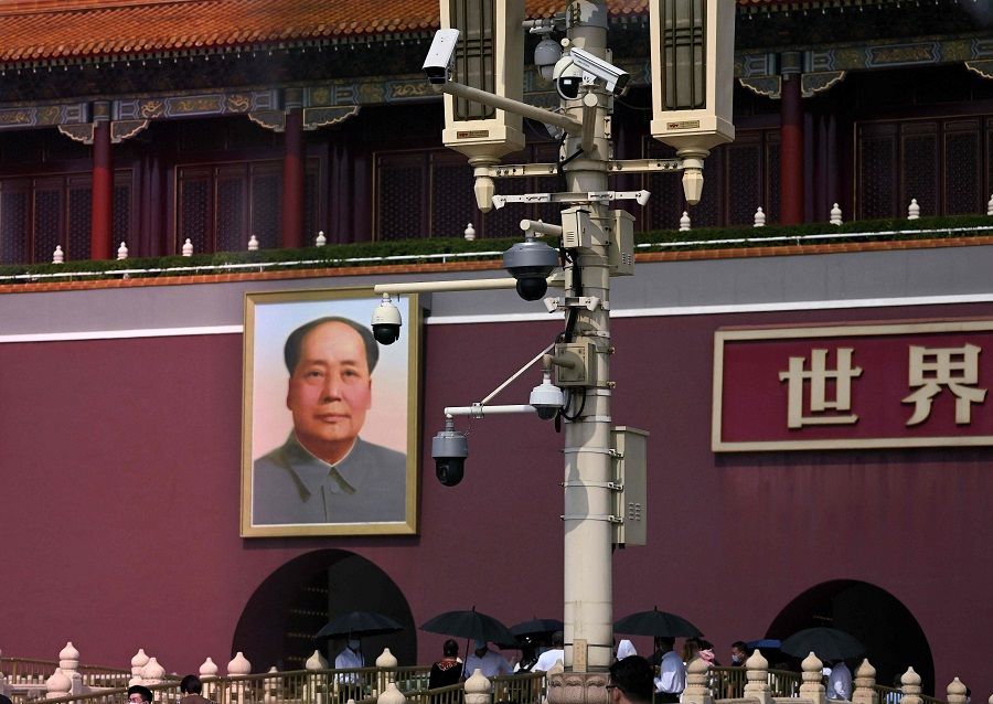 Security cameras are seen in front of a portrait of the late communist leader Mao Zedong at the Tiananmen Gate in Beijing, China on 27 September 2022. (Noel Celis/AFP)