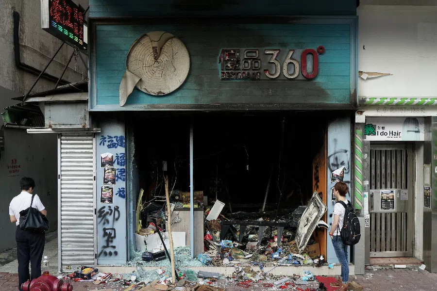 A vandalised Best Mart is seen during Sunday's anti-government protest in Hong Kong on 21 October 2019. Best Mart is perceived to be pro-Beijing by protesters. (Umit Bektas/Reuters)