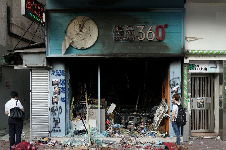 A vandalised Best Mart is seen during Sunday's anti-government protest in Hong Kong on 21 October 2019. Best Mart is perceived to be pro-Beijing by protesters. (Umit Bektas/Reuters)