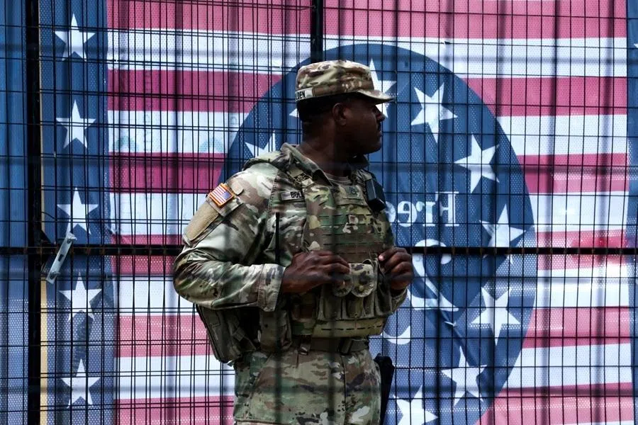 A US National Guard troop stands at an entrance to the “The Great American State Fair: The Future of America”, as part of celebrations marking the 250th anniversary of the US, in Washington, DC, US, on 8 July 2026.