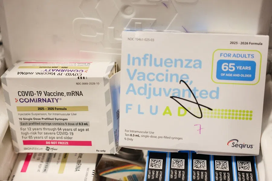 Boxes of the Pfizer-BioNTech Covid-19 vaccine and Seqirus Fluad adjuvanted flu shot are kept in cold storage during an immunisation event at the LA Care and Blue Shield of California Promise Health Plan Community Resource Center in the Panorama City neighborhood of Los Angeles, California, on 24 October 2025. (Patrick T. Fallon/AFP)