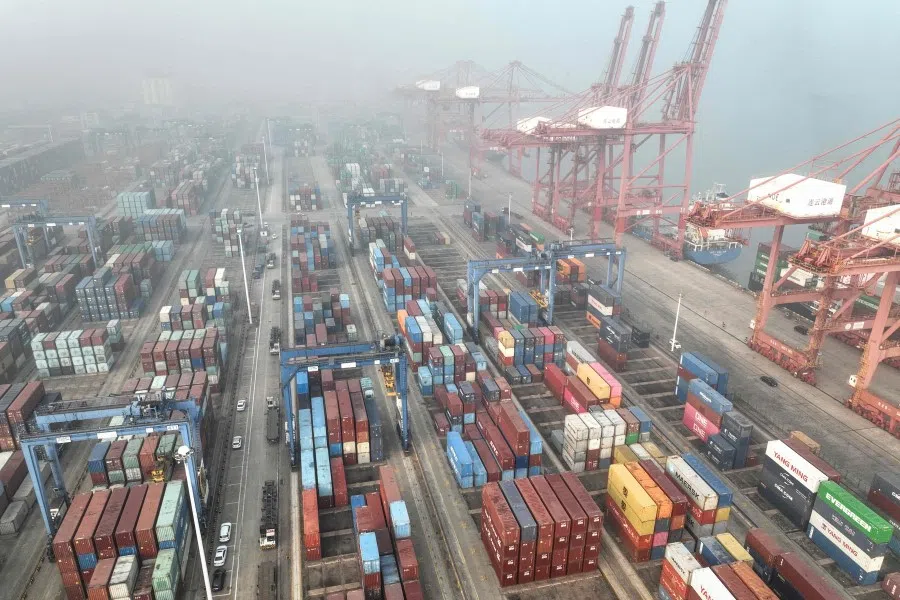 An aerial view of shipping containers stacked at a port in Lianyungang, in eastern China's Jiangsu province on 12 January 2024. (AFP)