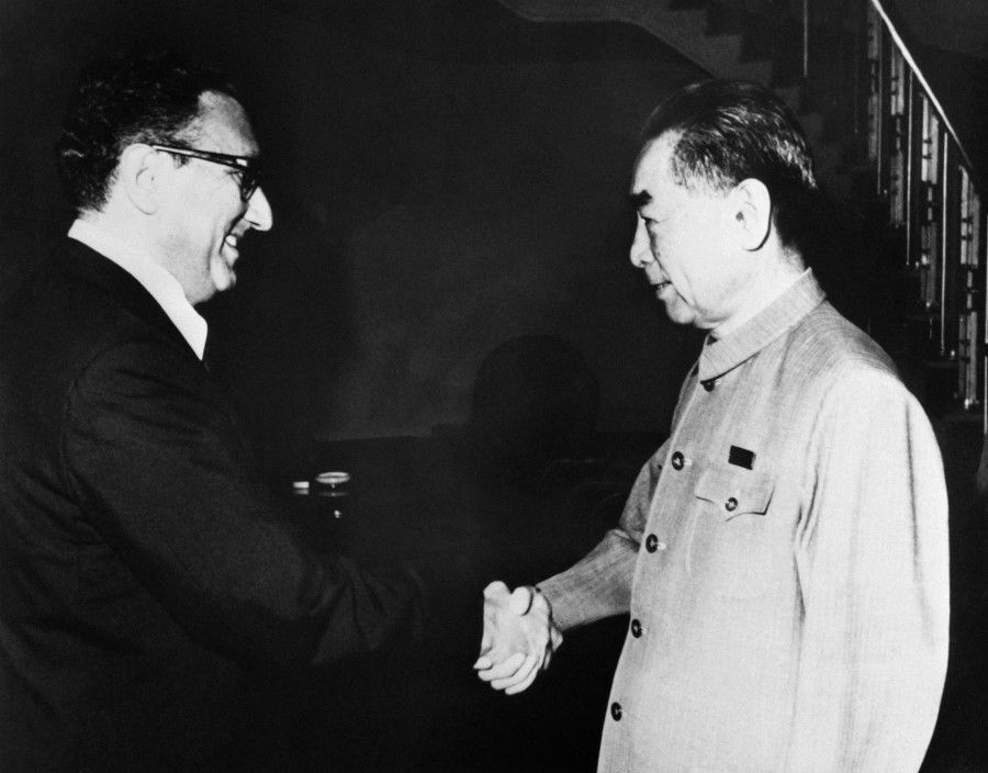 US president Nixon's special adviser, Henry Kissinger (left), shakes hands with Chinese Prime Minister Zhou Enlai (R), during their secret meeting, on 9 July 1971 in Beijing. (Consolidated News Pictures/AFP)