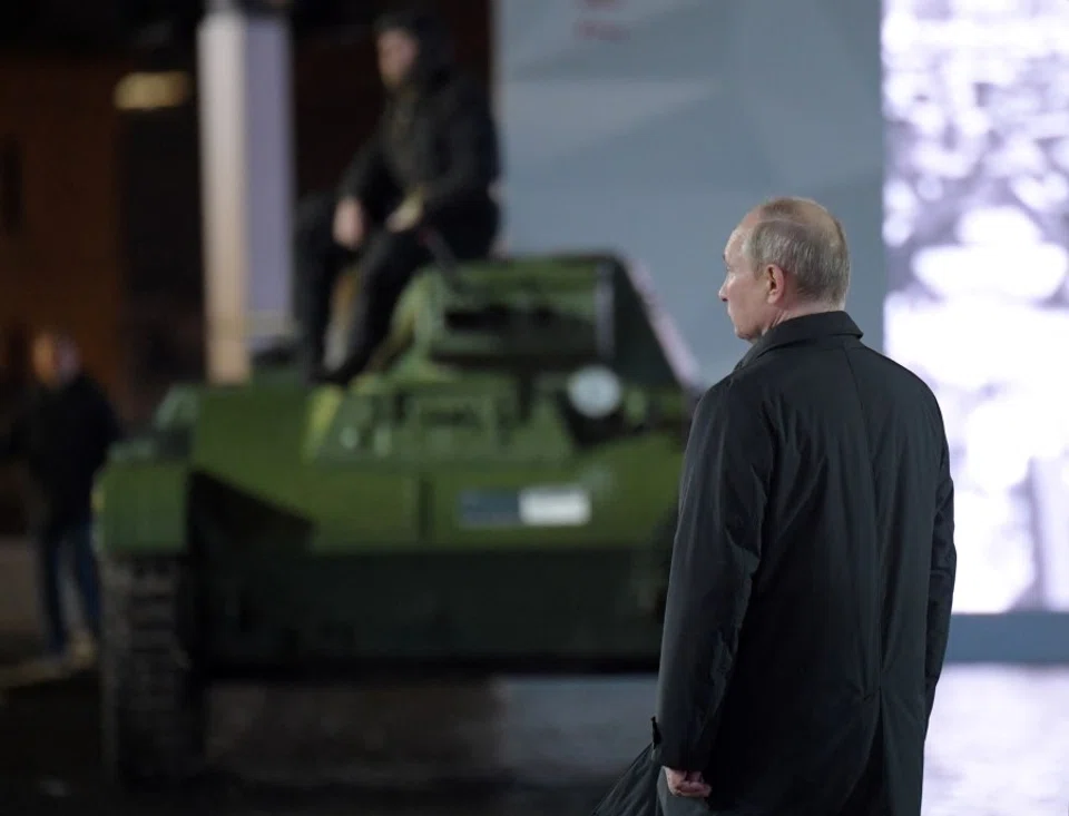 Russian President Vladimir Putin attends an exhibition marking the anniversary of a historical parade in 1941, when Soviet soldiers marched towards the front lines during World War Two, in Red Square in central Moscow, Russia, 8 November 2022. (Aleksey Nikolskyi/Kremlin/Sputnik via Reuters)