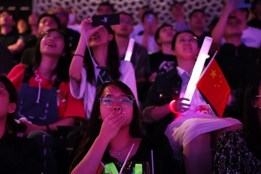 People watch the Arena of Valor Asian Games Version Final at the Hangzhou Esports Center, Hangzhou, Zhejiang province, China, on 26 September 2023. (Ann Wang/Reuters)