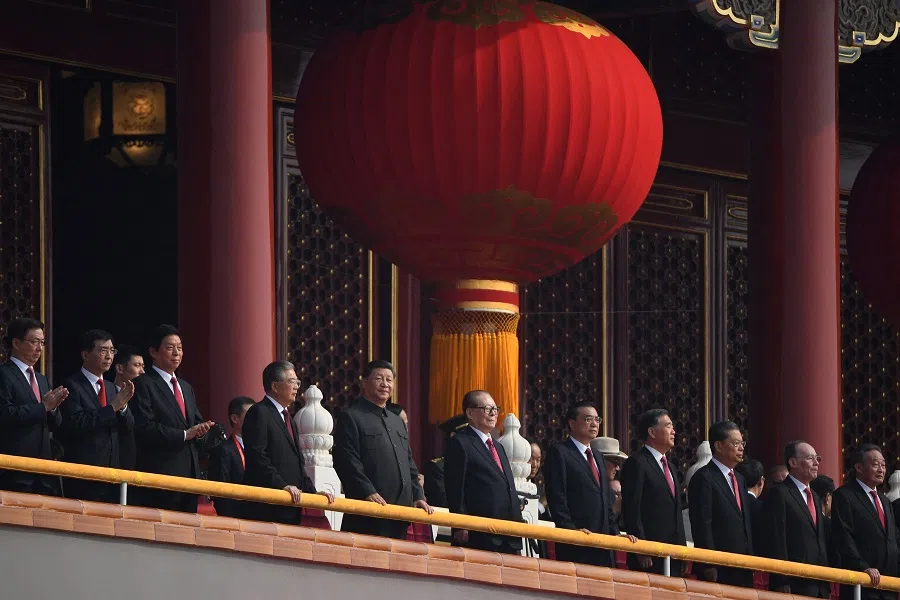 This file photo taken on 1 October 2019 shows China’s President Xi Jinping  attending a military parade with former presidents Hu Jintao and Jiang Zemin in Tiananmen Square in Beijing, to mark the 70th anniversary of the founding of the People’s Republic of China. (Greg Baker/AFP)
