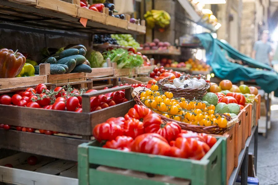 Vegetables and fruits at a shop on a street in Italy.