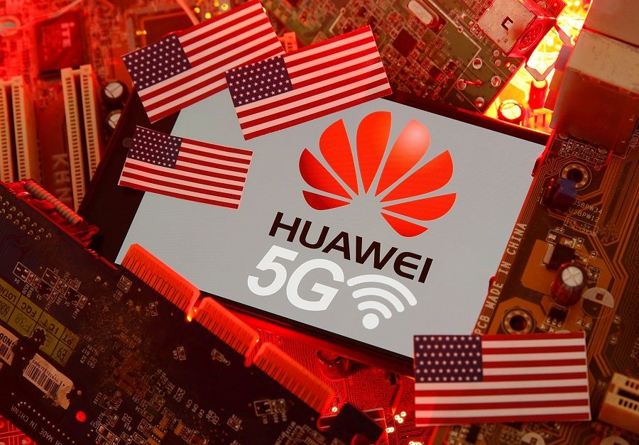 The US flag and a smartphone with the Huawei and 5G network logo are seen on a PC motherboard in this illustration taken on 29 January 2020. (Dado Ruvic/Illustration/File Photo/Reuters)