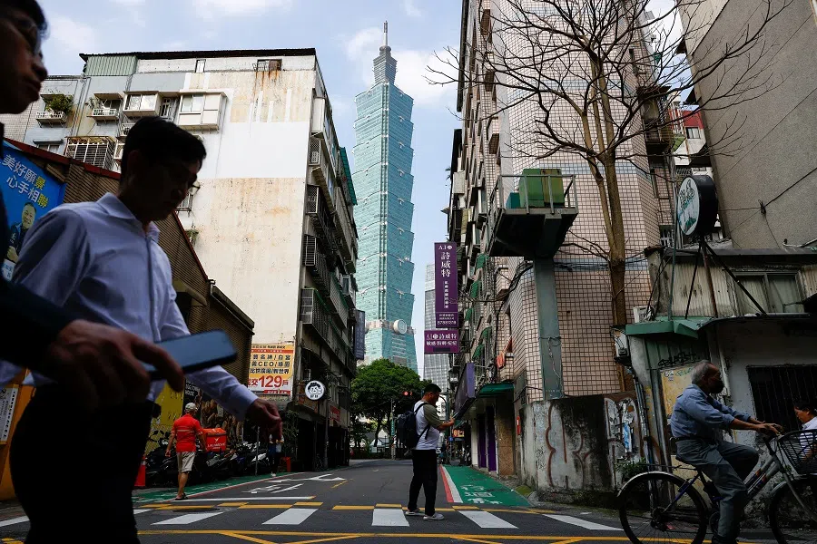 People and cars can be seen passing Taipei 101 in Taipei, Taiwan, on 17 April 2025. (Ann Wang/Reuters)