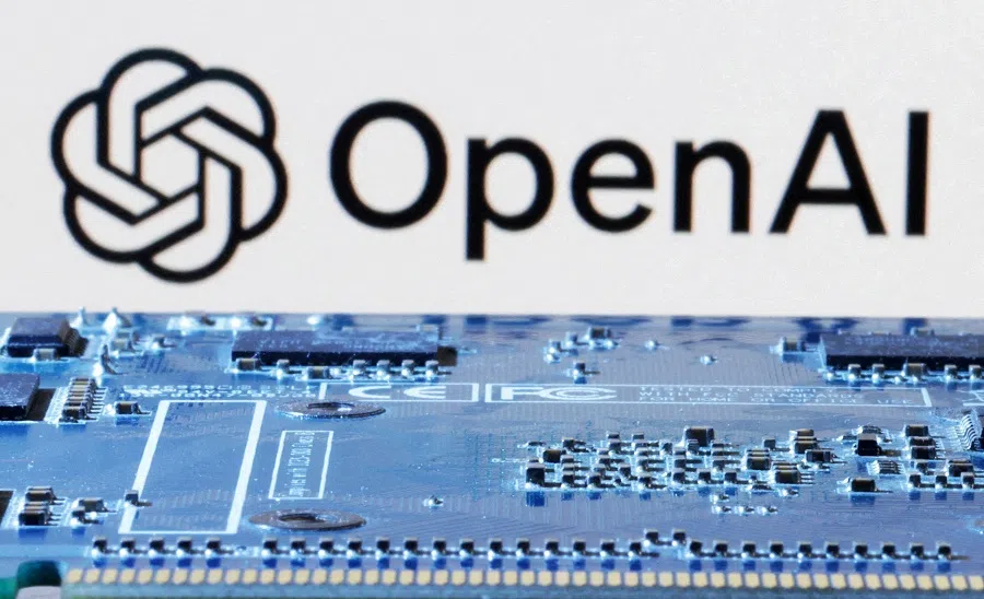 OpenAI logo is seen near a computer motherboard in this illustration taken on 8 January 2024.