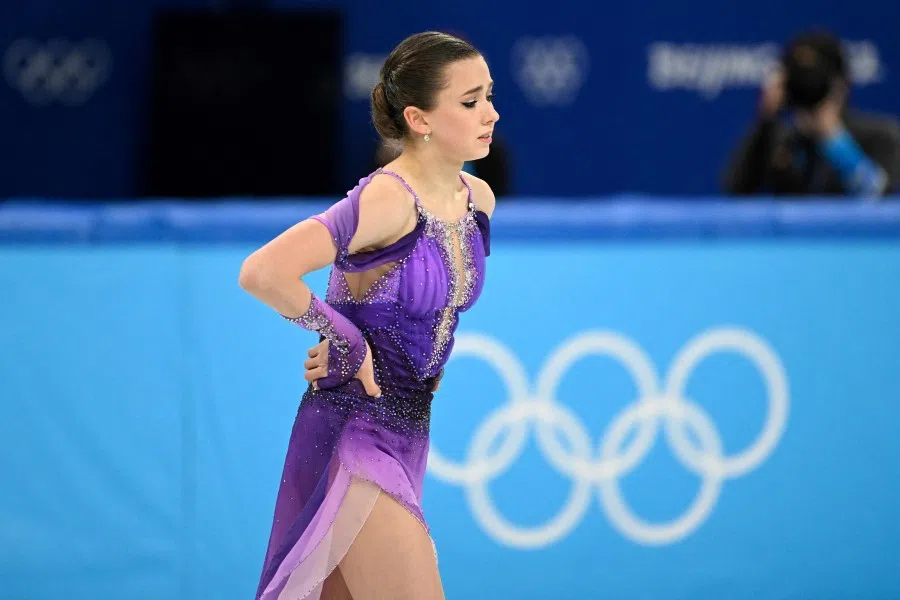 Russia's Kamila Valieva reacts after competing in the women's single skating short programme of the figure skating event during the Beijing 2022 Winter Olympic Games at the Capital Indoor Stadium in Beijing on 15 February 2022. (Manan Vatsyayana/AFP)