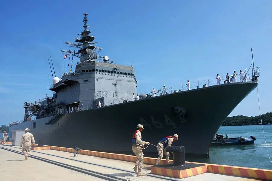 This handout photo taken and released on 19 April 2025 by the embassy of Japan in Cambodia shows Royal Cambodian Navy personnel securing the Japan Maritime Self-Defense Force (JMSDF) mine countermeasures vessel JS Bungo during docking at the Ream Naval Base, located off Cambodia’s southern coast in Preah Sihanouk province. (Embassy of Japan in Cambodia/Handout via AFP)