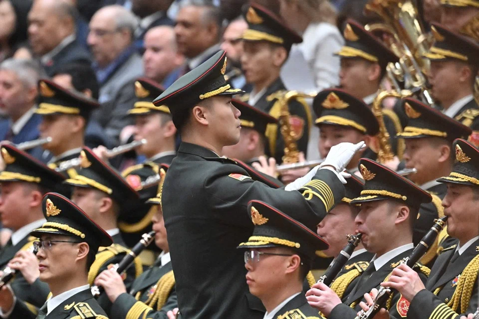The People’s Liberation Army (PLA) band performs during the opening session of the National People’s Congress (NPC) at the Great Hall of the People in Beijing on 5 March 2025. (Adek Berry/AFP)