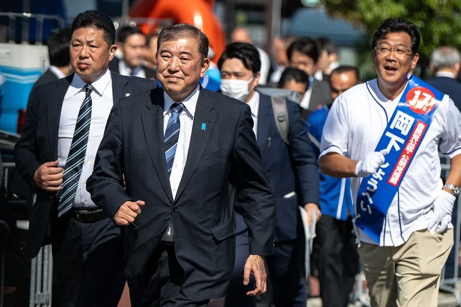 Japan’s PM Shigeru Ishiba (second from left) is seen during an election campaign speech in support of the Liberal Democratic Party candidate in Sakai city of Osaka prefecture on 20 October 2024. (Philip Fong/AFP)