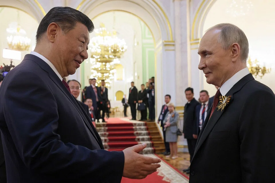 Russian President Vladimir Putin shakes hands with Chinese President Xi Jinping during a reception at the Kremlin in Moscow, Russia, on 9 May 2025. (Sputnik/Mikhail Metzel/Pool via Reuters)