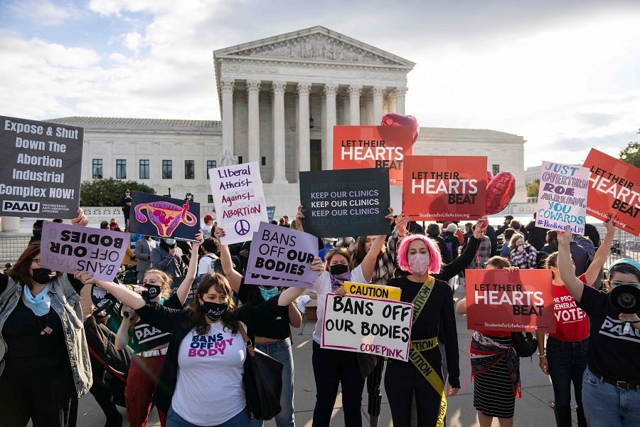 In this file photo taken on 1 November 2021, pro-choice and anti-abortion demonstrators rally outside the US Supreme Court in Washington, DC, US. (Drew Angerer/Getty Images North America/AFP)