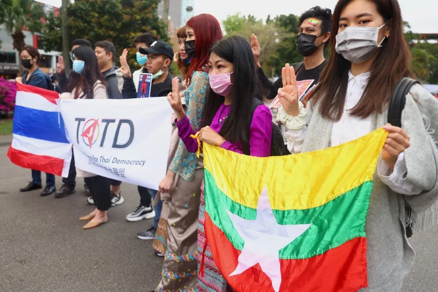 People show the three-finger salute against the Myanmar military coup as part of the Milk Tea Alliance united rally in Taipei, Taiwan, 28 February 2021. (Ann Wang/Reuters)
