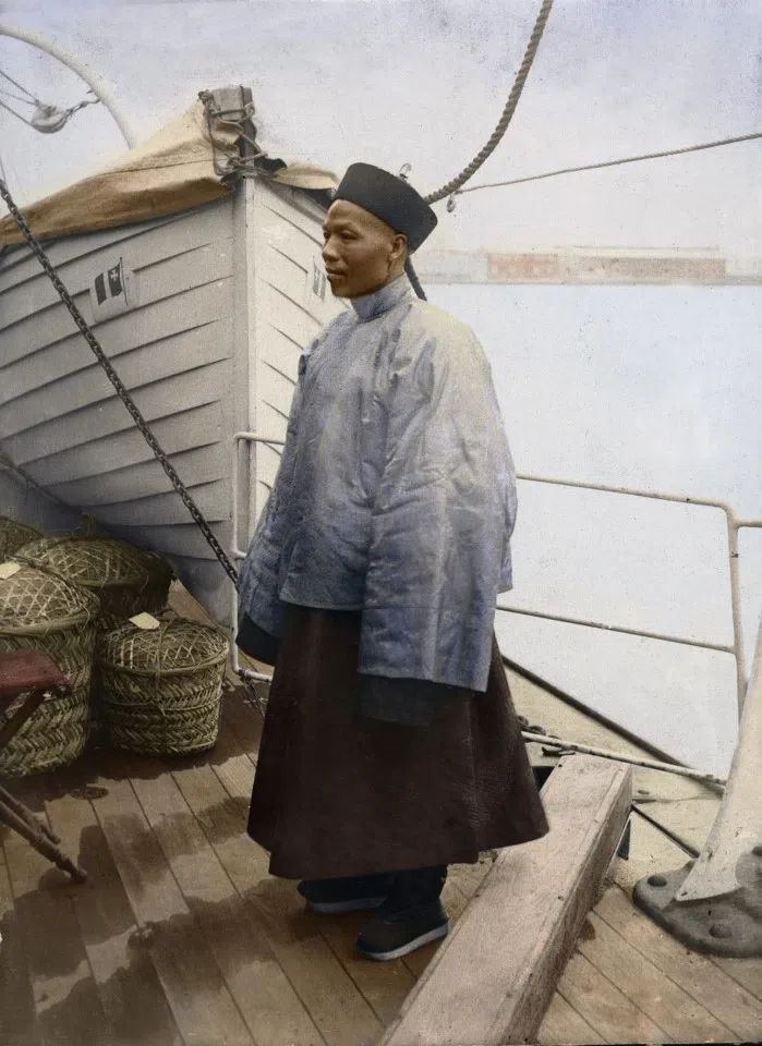 A Chinese "agent" on board a coolie boat. His job was to recruit villagers back home to cross the sea to work. He also managed them and even travelled with them to make sure everything went smoothly. The Western bosses who brought in the coolies also needed the Chinese agents to pass on instructions. Written records say little about the agents; they are generally thought to be akin to foremen. But this photograph shows that some agents were quite well to do, almost like Chinese merchants. Some successful agents even rose to become international traders.