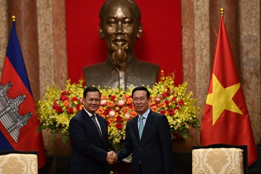 Cambodia's Prime Minister Hun Manet (left) shakes hands with Vietnam's President Vo Van Thuong during a meeting at the Presidential Palace in Hanoi, Vietnam, on 11 December 2023. (Nhac Nguyen/AFP)