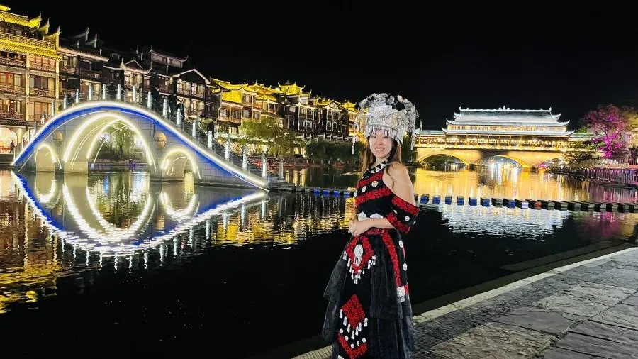 My travel companion sporting the Miao costume picked out for her at the travel photography shop.