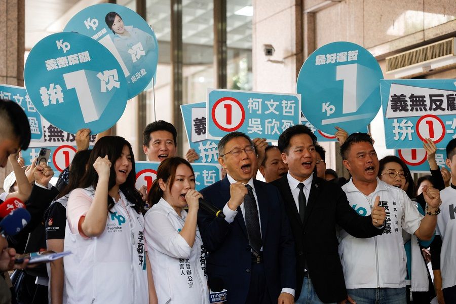 Ko Wen-je, Taiwan People's Party (TPP) chairman and presidential candidate, shouts slogans next to supporters outside the Central Election Commission in Taipei, Taiwan, on 11 December 2023. (Reuters/Carlos Garcia Rawlins)