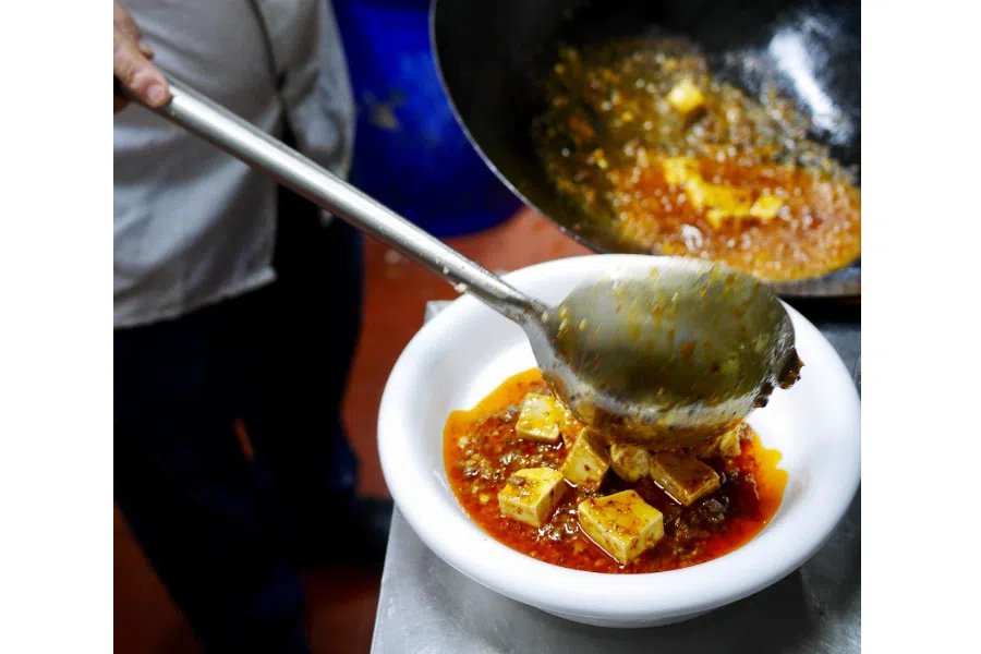 Master chef cooking Mapo Tofu.