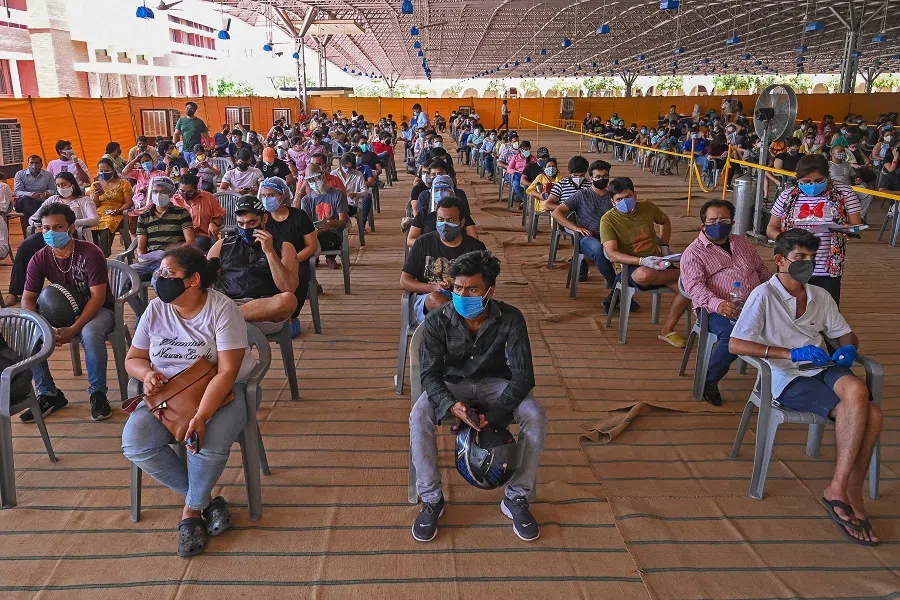 People wait to get a dose of the Covishield vaccine against the Covid-19 coronavirus at the vaccination centre of BLK-Max hospital in New Delhi, India on 4 May 2021. (Prakash Singh/AFP)