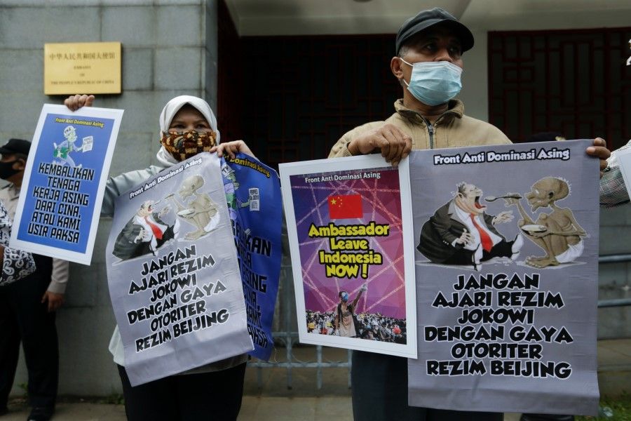 People protest outside the Chinese embassy following reports that China has encroached on Indonesia's maritime area in the South China Sea, in Jakarta, Indonesia, 8 December 2021. (Ajeng Dinar Ulfiana/Reuters)