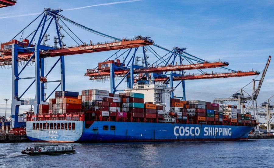 A container ship of China's COSCO Shipping Corporation is unloaded at the Tollerort Container Terminal owned by HHLA, in the harbour of Hamburg, northern Germany on 26 October 2022. (Axel Heimken/AFP)