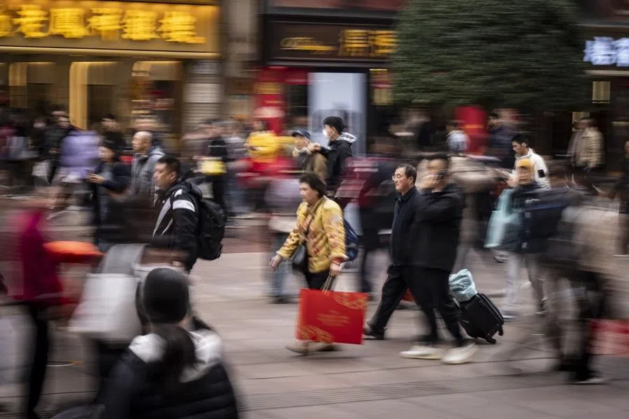 Shoppers on Nanjing East Road in Shanghai, China, on 19 February 2026. (Qilai Shen/Bloomberg)