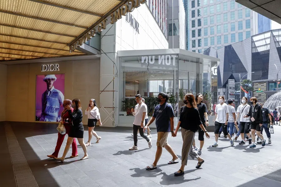 Pedestrians outside a Dior store at Pavilion Kuala Lumpur in Bukit Bintang area in Kuala Lumpur, Malaysia, on 16 January 2023. (Samsul Said/Bloomberg)