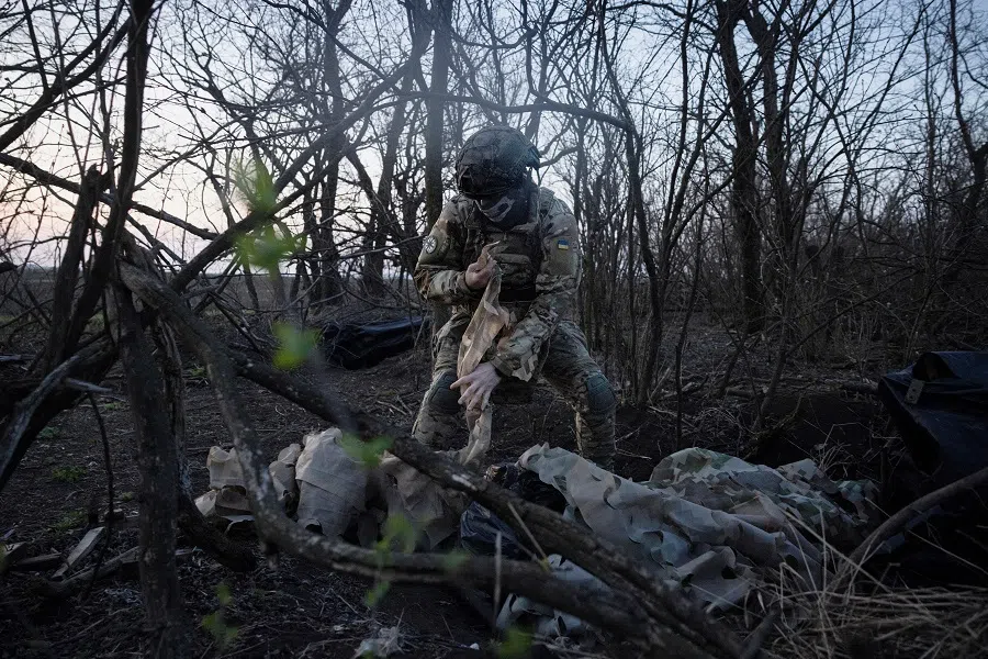 A member of a drone unit of Ukraine’s 58th Motorized Brigade unpacks equipment near the front line in the Donetsk region, amid Russia’s attack on Ukraine, in Ukraine on 9 April 2024. (Thomas Peter/Reuters)