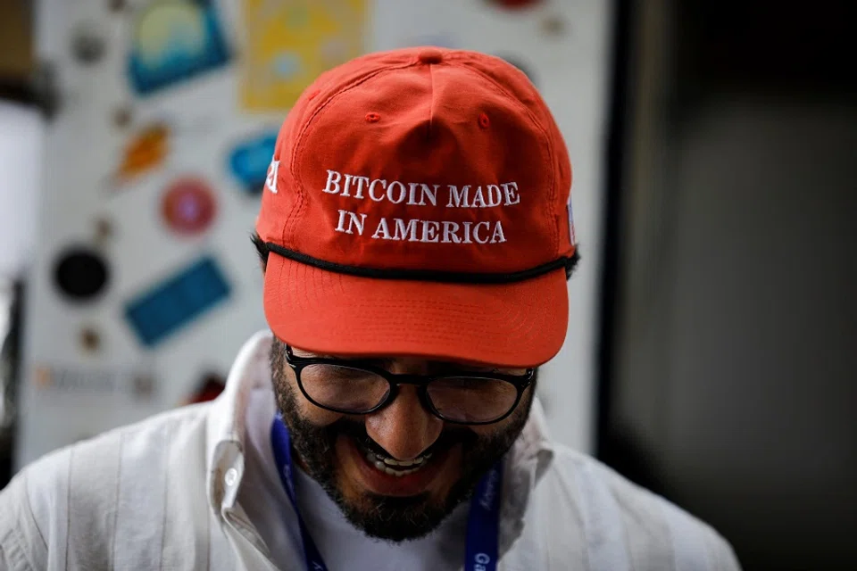 A man checks a Bitcoin transaction during Adopting Bitcoin 2024 – High-Signal Bitcoin conference for builders, in Nuevo Cuscatlan, El Salvador, on 16 November 2024. (Jose Cabezas/Reuters)