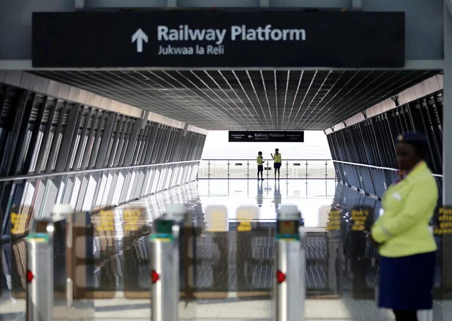 Attendants wait to usher in passengers at the Nairobi Terminus building operating the Standard Gauge Railway line constructed by the China Road and Bridge Corporation and financed by Chinese government in the outskirts of Nairobi, Kenya, 16 October 2019. (Thomas Mukoya/Reuters)