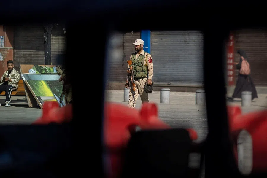 An Indian security force personnel stands guard on a street, following an attack on tourists near Pahalgam in south Kashmir, in Srinagar, on 29 April 2025. (Adnan Abidi/Reuters)