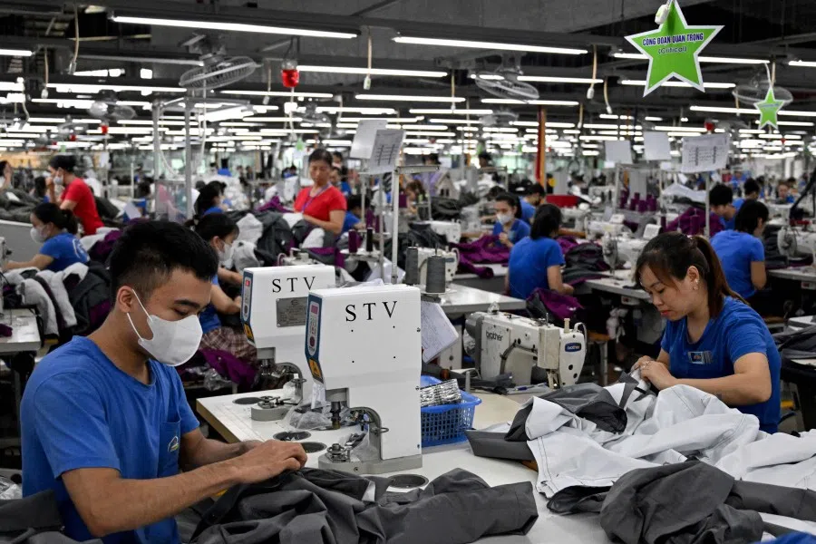 Workers stitch apparels at a garment factory in Vietnam’s Thai Nguyen province on 2 July 2025.