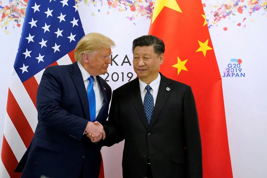 US President Donald Trump and China’s President Xi Jinping shake hands ahead of their bilateral meeting during the G20 leaders summit in Osaka, Japan, on 29 June 2019. (Kevin Lamarque/Reuters)